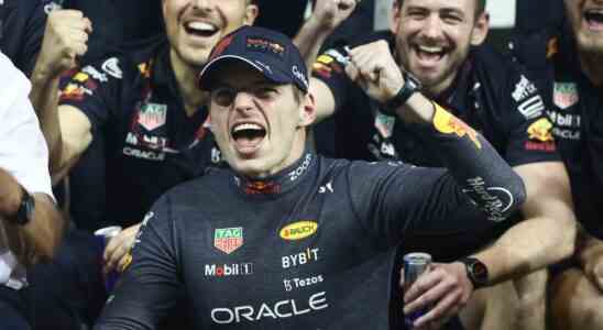 Max Verstappen of Red Bull Racing poses for a photo with the team after the Formula 1 Abu Dhabi Grand Prix at Yas Marina Circuit in Abu Dhabi, United Arab Emirates on November 20, 2022.
