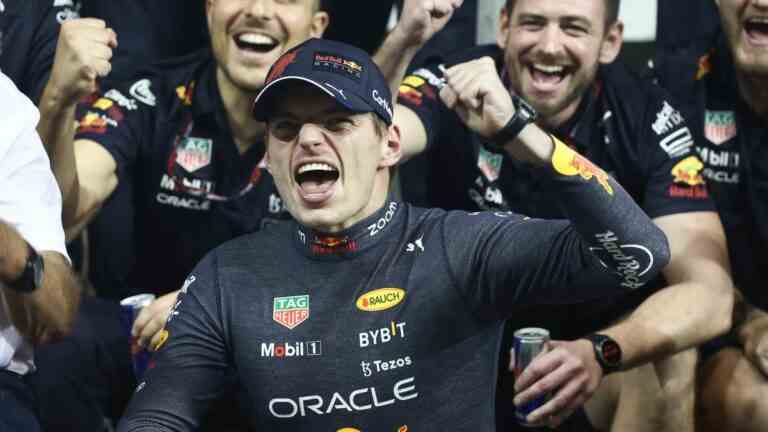 Max Verstappen of Red Bull Racing poses for a photo with the team after the Formula 1 Abu Dhabi Grand Prix at Yas Marina Circuit in Abu Dhabi, United Arab Emirates on November 20, 2022.