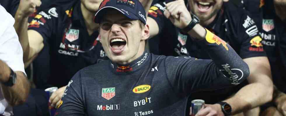 Max Verstappen of Red Bull Racing poses for a photo with the team after the Formula 1 Abu Dhabi Grand Prix at Yas Marina Circuit in Abu Dhabi, United Arab Emirates on November 20, 2022.