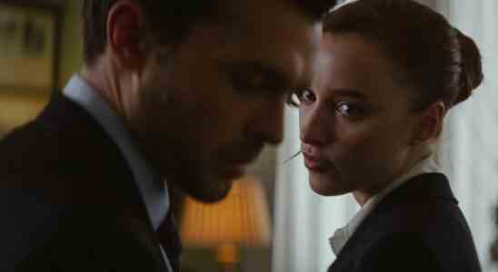 Phoebe Dynevor (background) looks at Alden Ehrenreich (foreground) in a still from "Fair Play"