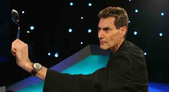 Uri Geller bending a spoon.