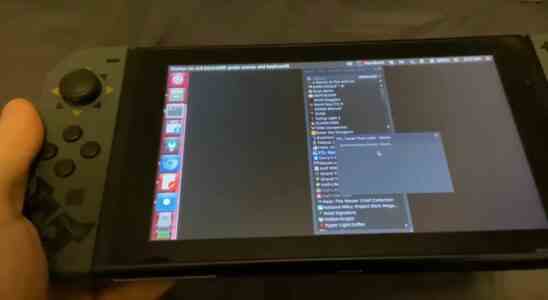 A close up of a Nintendo Switch running Linux with a list of Steam games to install, currently attempting to run FTL: Faster Than Light