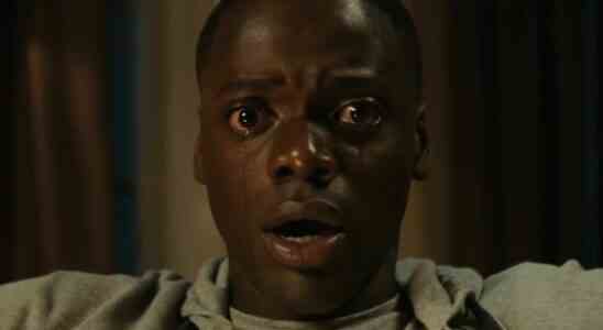 A close-up of Daniel Kaluuya shedding tears in a scene from Get Out.