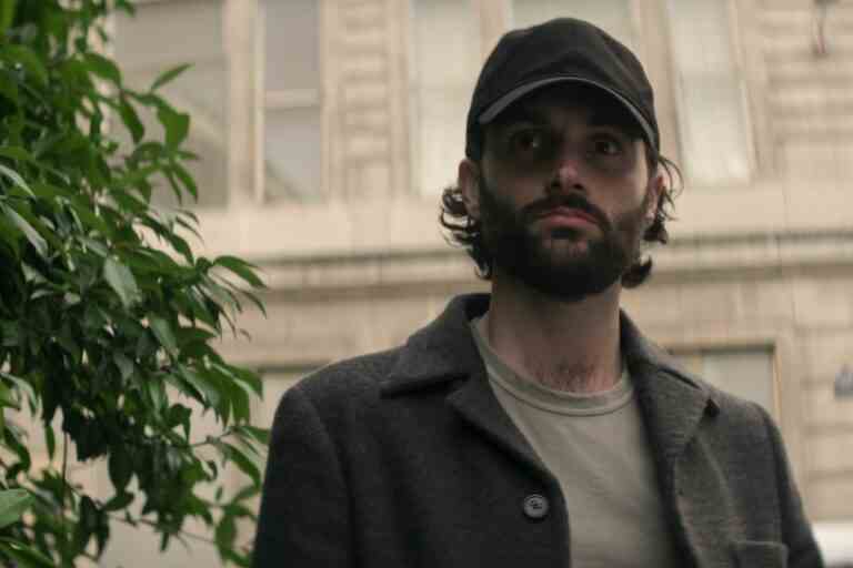 A man with dark hair and beard wearing an unmarked baseball cap; still from "You."