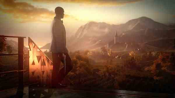 Agent 47 walks in profile, holding a pistol and looking away from the camera towards sunlit mountains in the background.