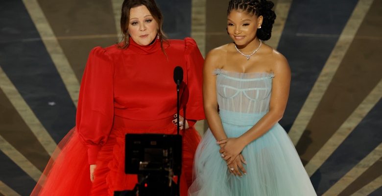 HOLLYWOOD, CALIFORNIA - MARCH 12: (L-R) Melissa McCarthy and Halle Bailey speak onstage during the 95th Annual Academy Awards at Dolby Theatre on March 12, 2023 in Hollywood, California. (Photo by Kevin Winter/Getty Images)