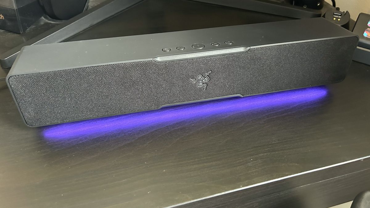 Razer Leviathan V2 X soundbar on a desk with RGB lighting switched on