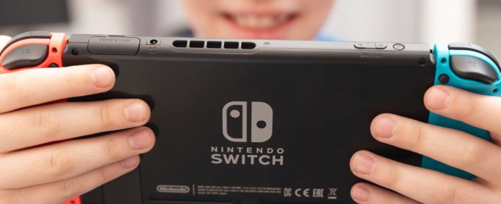 Child holding a Nintendo Switch