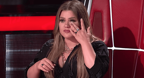 Kelly Clarkson cries after a performance on The Voice.