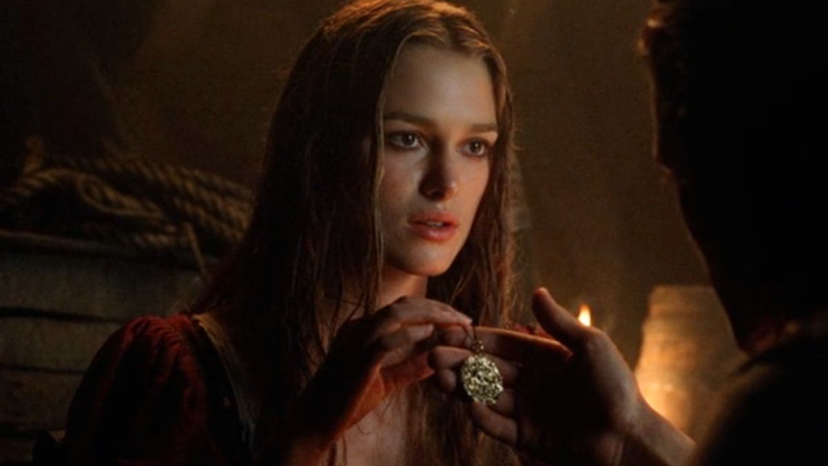 Keira Knightley holding the pendant in Pirates of the Caribbean