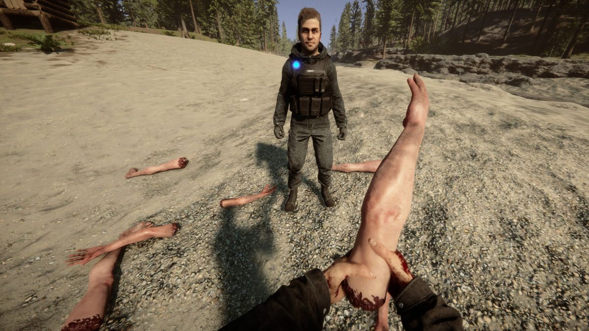 man holding severed arm with other limbs scattered around