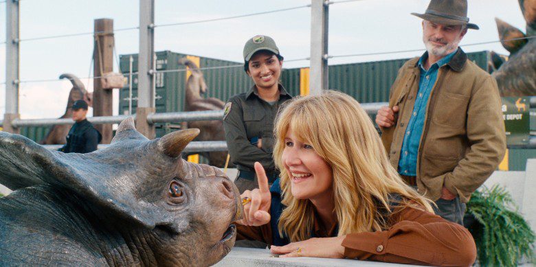 JURASSIC WORLD DOMINION, (aka JURASSIC WORLD 3), from left: a baby Nasutoceratops, Laura Dern, Sam Neill, 2022. © Universal Pictures / Courtesy Everett Collection