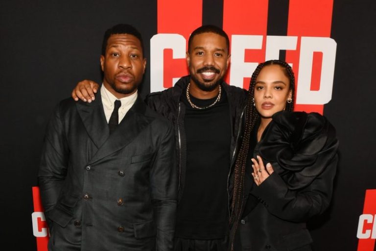 ATLANTA, GEORGIA - FEBRUARY 23: (L-R) Jonathan Majors, Michael B. Jordan and Tessa Thompson attend the CREED III HBCU fan screening presented by MGM Studios at Regal Atlantic Station on February 23, 2023 in Atlanta, Georgia. (Photo by Paras Griffin/Getty Images for MGM Studios)