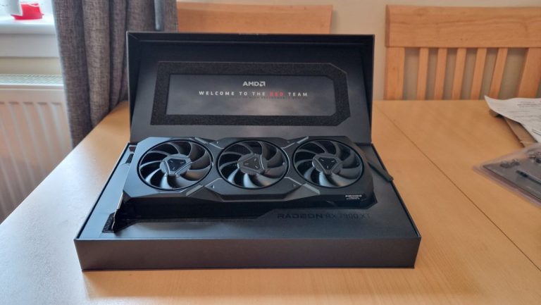 AMD Radeon RX 7900 XT review image showing the GPU in its raised open box position