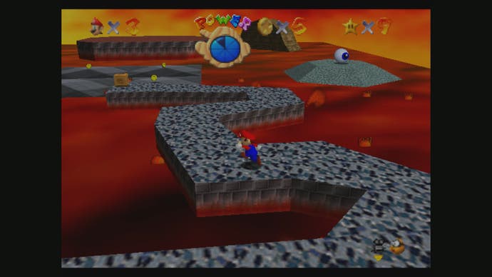 Meilleurs jeux Mario - Capture d'écran de Super Mario 64 montrant mario courant sur un chemin pavé à travers la lave.