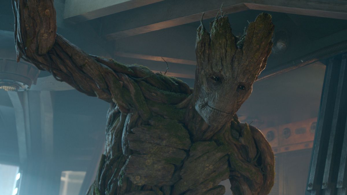 Groot stands smiling in a ship