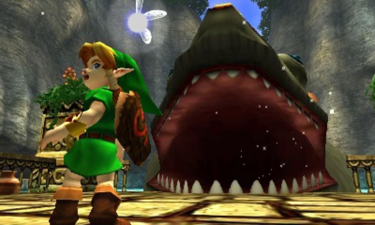 Link se tourne pour fuir Jabu-Jabu alors que le poisson géant se prépare à l'inhaler dans The Legend of Zelda: Ocarina of Time 3d