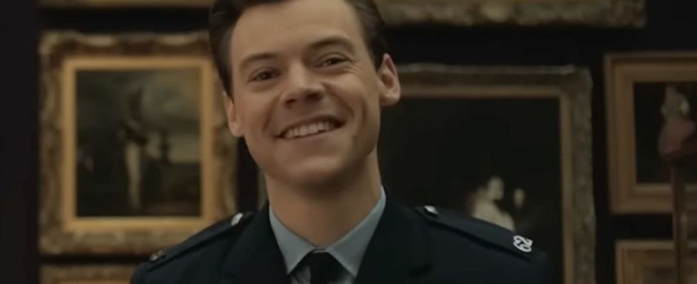 Harry Styles smiling at a painting in My Policeman.