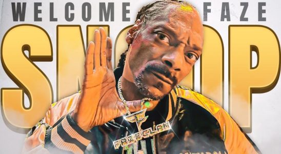 Snoop Dogg holds up a FaZe Clan necklace while posing in front of a sign reading