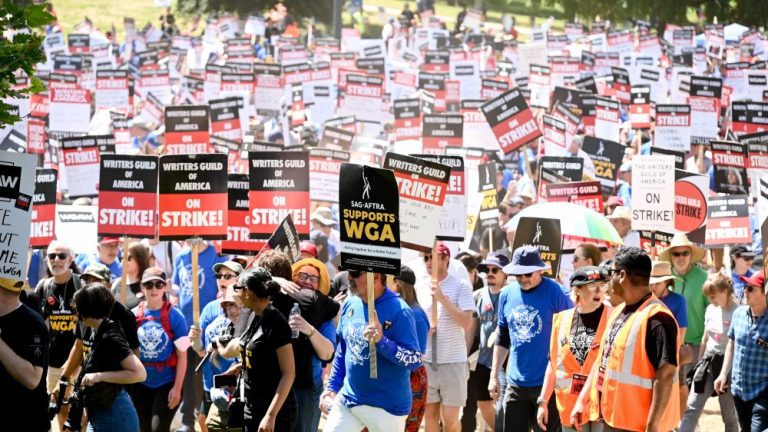 Protestors gather in support of the 2023 Writers Guild of America strike at La Brea Tar Pits in Los Angeles, California on June 21, 2023.