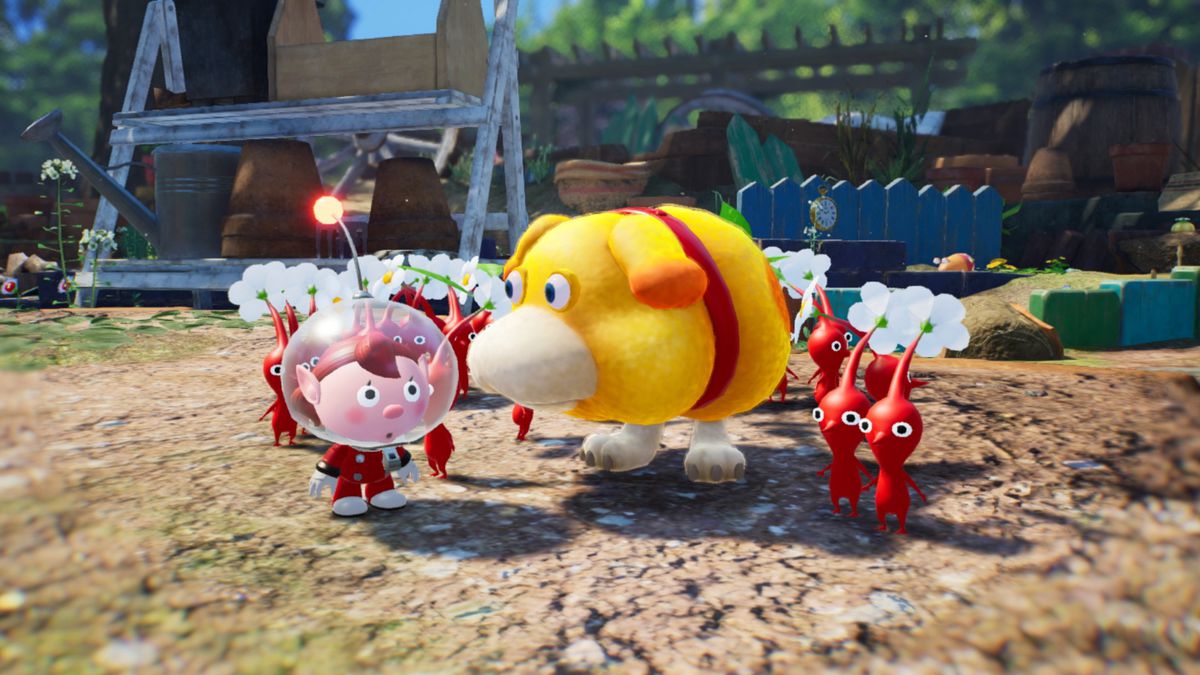 Olimar, son compagnon chien Oatchi et un groupe de Pikmin rouges dans Pikmin 4