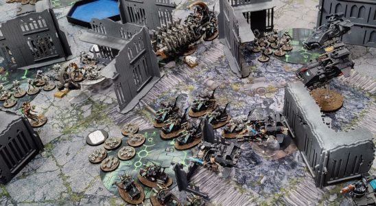 Warhammer 40,000 10th Edition being played on a ruined battlefield, with Space Marines taking on Necrons