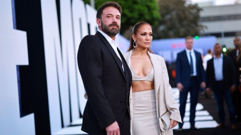 Ben Affleck and Jennifer Lopez posing together on the red carpet of The Mother premiere.