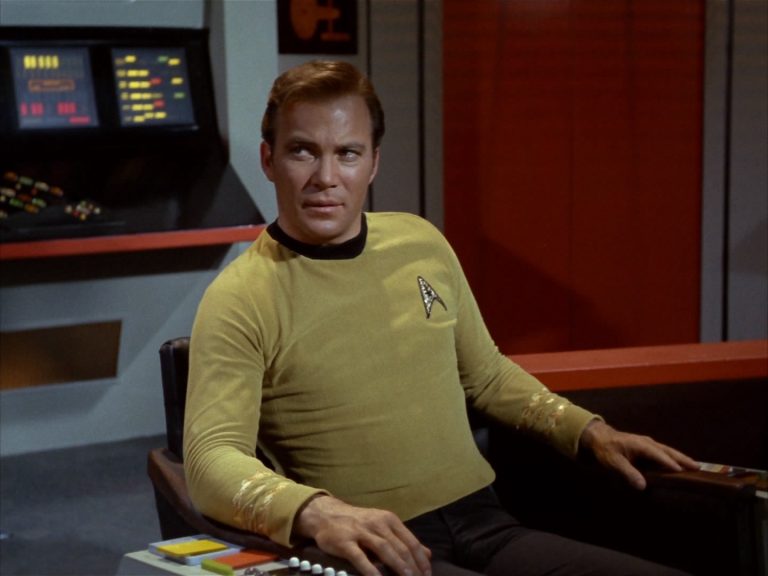 William Shatner as Captain Kirk sits on the bridge of the Enterprise