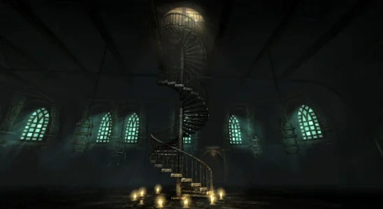 A dimly lit spiral staircase in Amnesia: The Dark Descent.