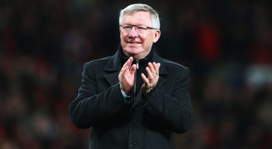 Football manager Alex Ferguson looking happy.