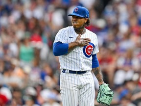 Marcus Stroman des Cubs de Chicago se frappe la poitrine lors de la cinquième manche d'un match contre les Red Sox de Boston au Wrigley Field le samedi 15 juillet 2023 à Chicago.