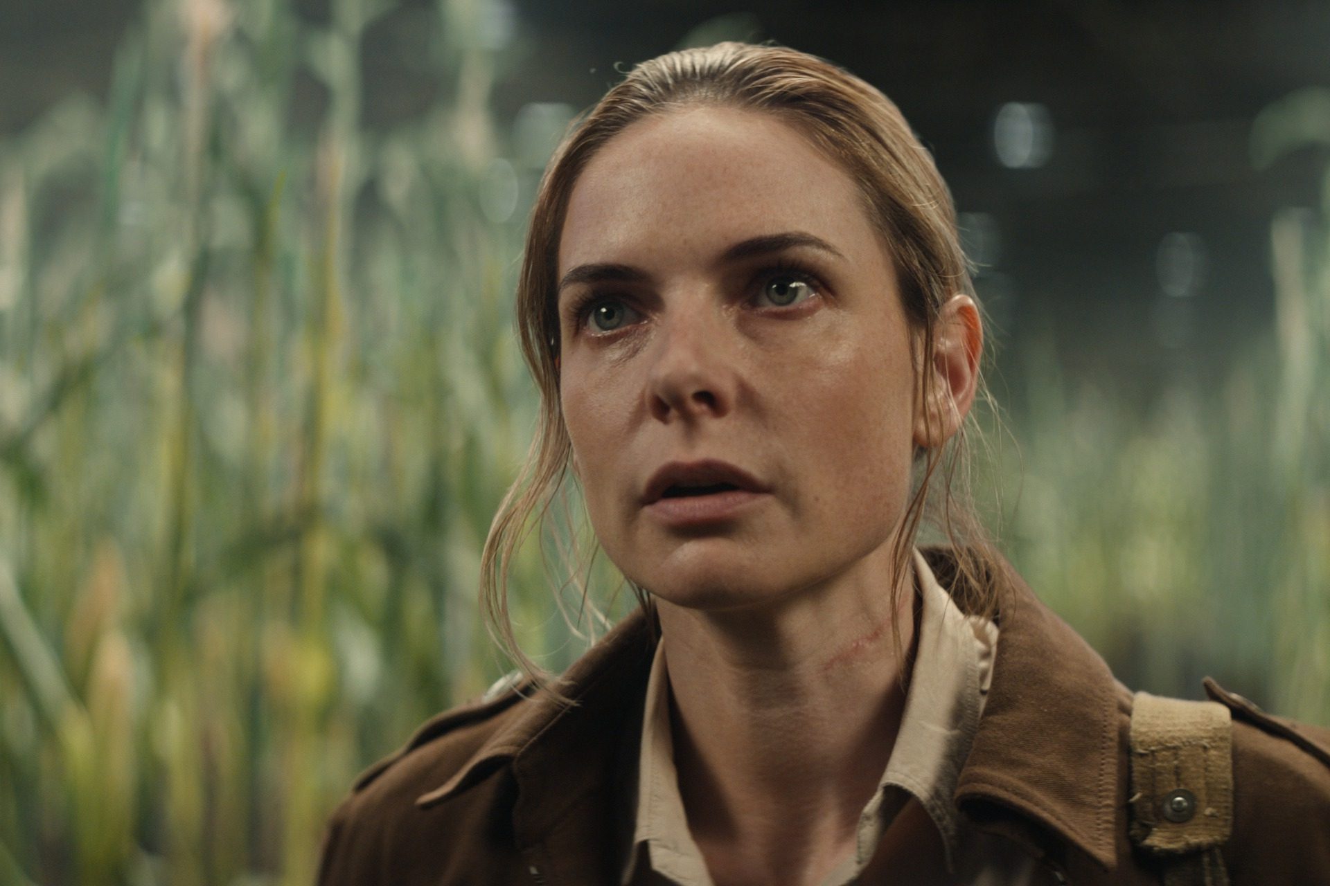 Juliette (Rebecca Ferguson) stands in a field of corn