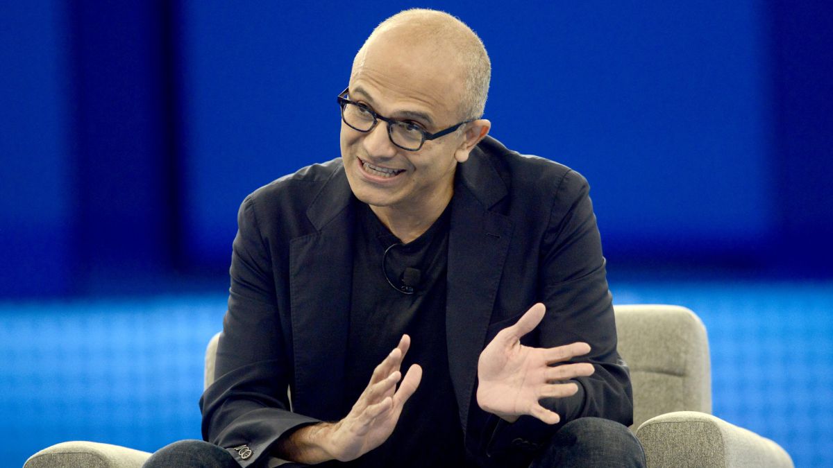 Microsoft CEO Satya Nadella speaking on stage.