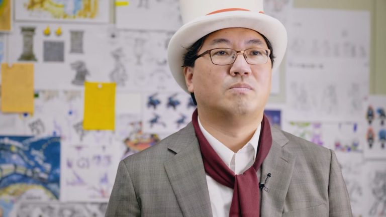 Yuji Naka presents Balan Wonderworld while dressed in a top hat and neckerchief.