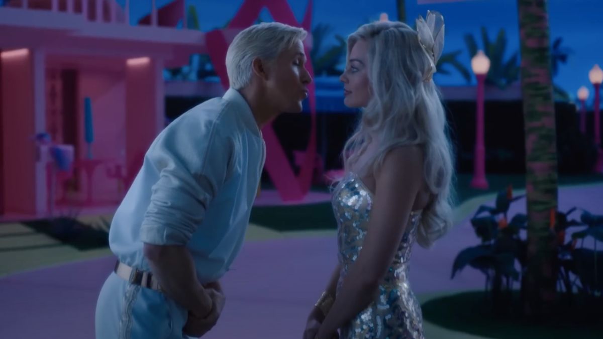 Ryan Gosling leaning in to kiss Margot Robbie as Ken in Barbie