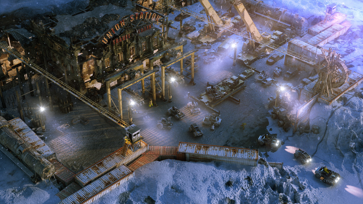 Une vue isométrique d'un complexe hivernal avec des camions qui le quittent dans le jeu vidéo Wasteland 3