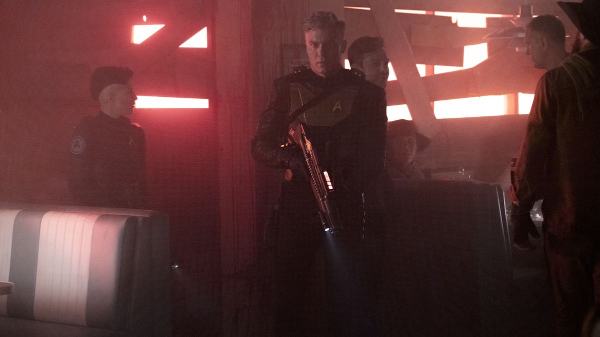 Captain Pike wielding laser rifle on Star Trek: Strange New Worlds