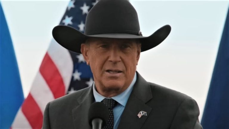 John Dutton and American flag in Yellowstone