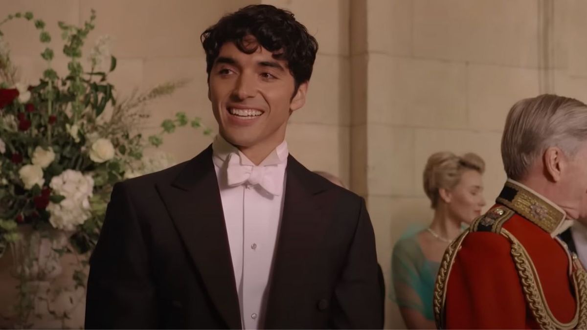 Alex smiling in a tuxedo at the royal wedding