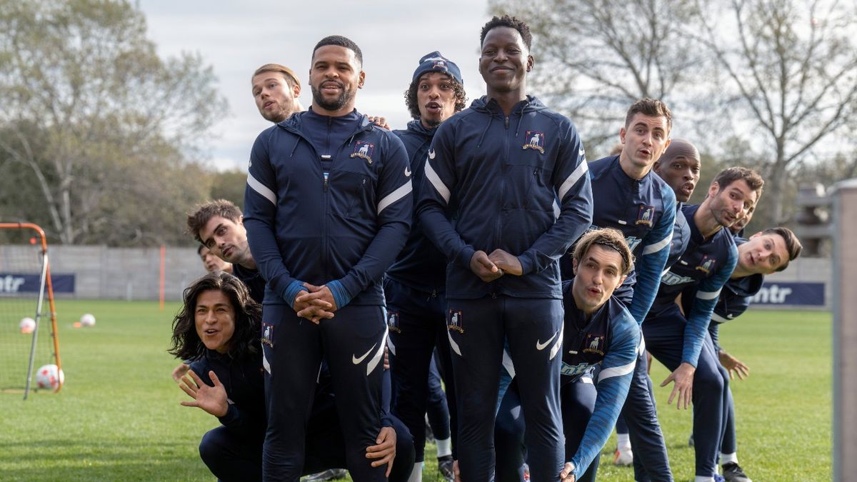 A press image of Cristo Fernández, Stephen Manas, David Elsendoorn, Kola Bokinni, Moe Hashim, Toheeb Jimoh, Phil Dunster, Billy Harris and Moe Jeudy-Lamour in 