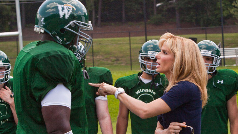 THE BLIND SIDE, foreground from left: Quinton Aaron, Sandra Bullock, 2009. Ph: Ralph Nelson/©Warner Bros./Courtesy Everett Collection