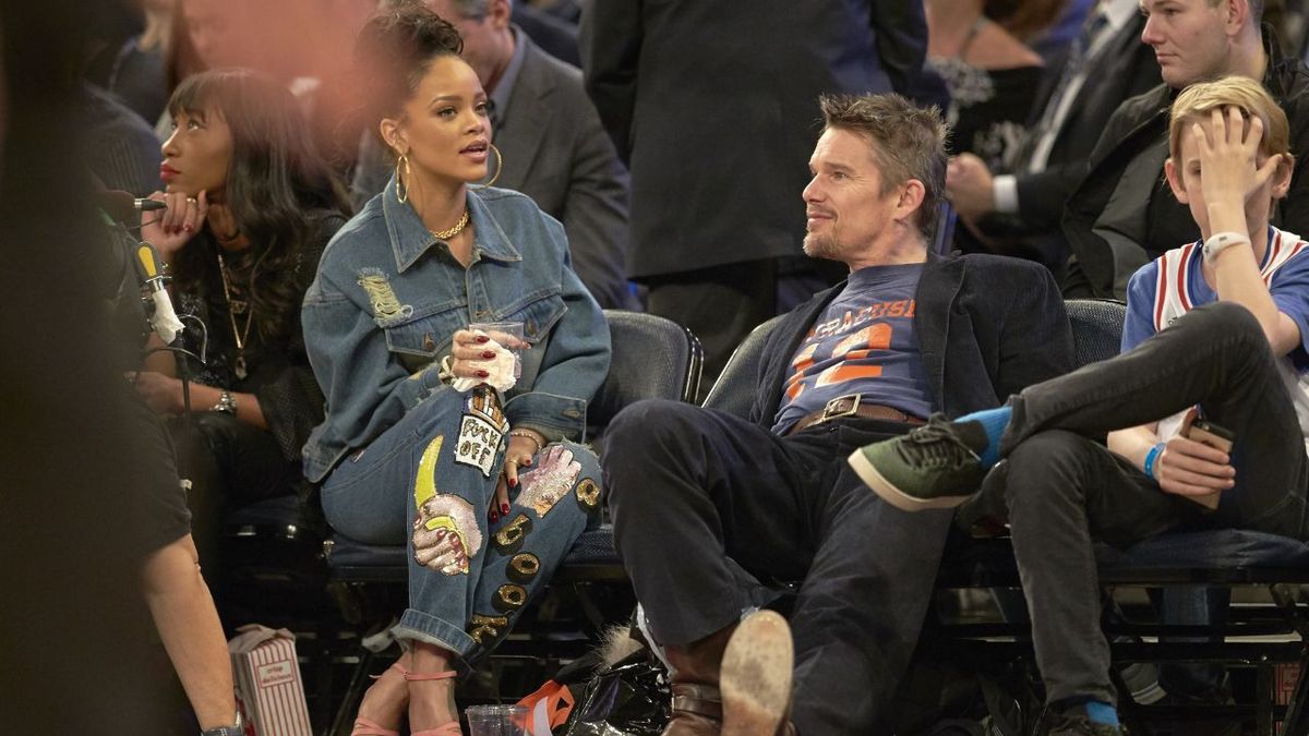 Ethan Hawke flirting with Rihanna at a basketball game