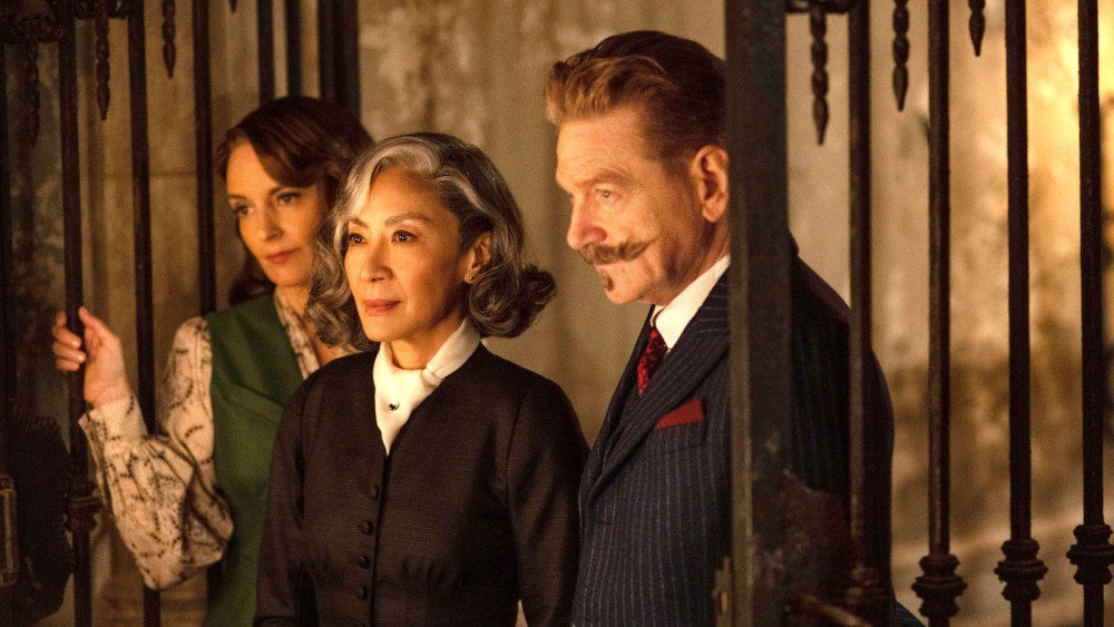 A HAUNTING IN VENICE, from left: Tina Fey, Michelle Yeoh, Kenneth Branagh as Hercule Poirot, 2023. ph: Rob Youngson / © Walt Disney Studios Motion Pictures /Courtesy Everett Collection