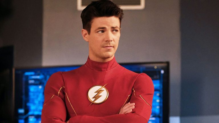 Grant Gustin wearing The Flash uniform without mask