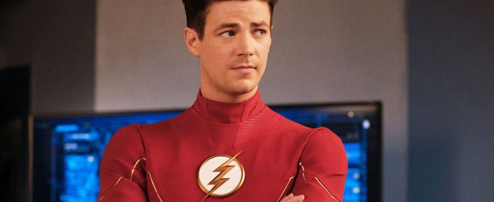 Grant Gustin wearing The Flash uniform without mask