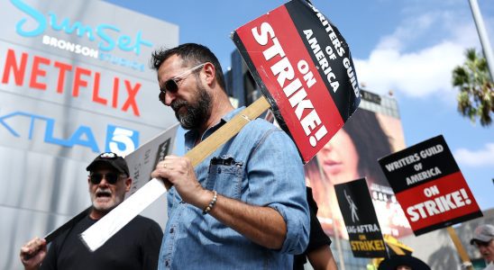 LOS ANGELES, CALIFORNIA - SEPTEMBER 18: Striking WGA (Writers Guild of America) members picket with striking SAG-AFTRA members outside Netflix studios on September 18, 2023 in Los Angeles, California. The Writers Guild of America and Alliance of Motion Picture and Television Producers (AMPTP) are set to meet for a new round of contract talks this week in the four-months long writers strike. (Photo by Mario Tama/Getty Images)