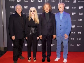 De gauche à droite, Chris Frantz, Tina Weymouth, Jerry Harrison et David Byrne assistent à la première de l'édition du 40e anniversaire de Stop Making Sense lors du Festival international du film de Toronto 2023 au Scotiabank Theatre, le lundi 11 septembre 2023, à Toronto.