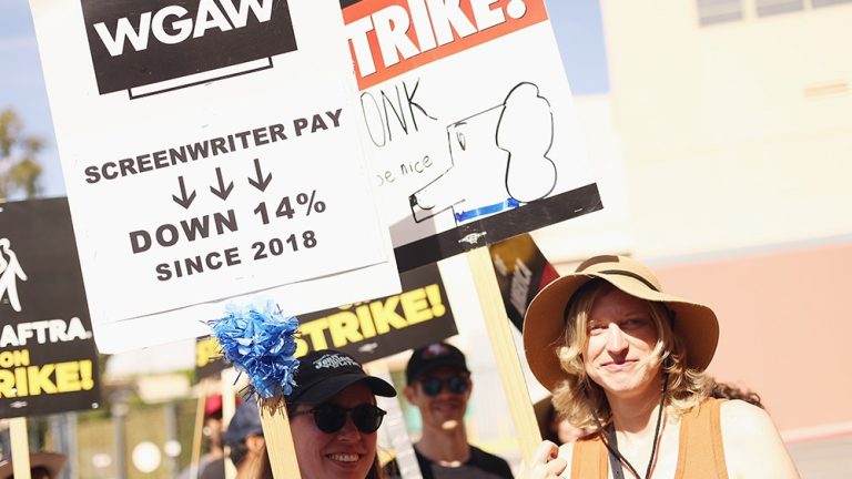 BURBANK, CALIFORNIA - JULY 21: Members and supporters of SAG-AFTRA and WGA walk the picket line at Disney Studios on July 21, 2023 in Burbank, California. Members of SAG-AFTRA, Hollywood's largest union which represents actors and other media professionals, have joined striking WGA (Writers Guild of America) workers in the first joint walkout against the studios since 1960. The strike could shut down Hollywood productions completely with writers in the third month of their strike against the Hollywood studios. (Photo by Tommaso Boddi/Getty Images)