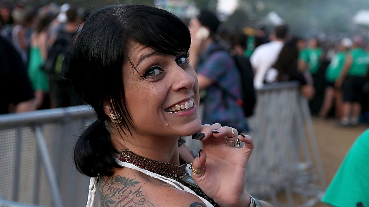 Danielle Colby in a white dress at Lollapalooza in Chicago.