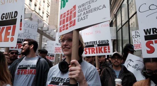 NEW YORK CITY - MAY 03: Members of the Writers Guild of America (WGA) East hold signs as they walk for the second day on the picket-line outside of Netflix's New York office on May 03, 2023 in New York City. WGA members were out on the first day of a Hollywood voters strike after the board of directors for the Writers Guild of America, which includes West Coast and East Coast branches, voted unanimously to call for a walkout. Negotiations between a top guild and a trade association that represents Hollywood’s top studios failed to avert the first walkout in more than 15 years. Union members have stated that they are not being paid fairly in the streaming era and are seeking pay increases and structural changes to the business model.  (Photo by Spencer Platt/Getty Images)